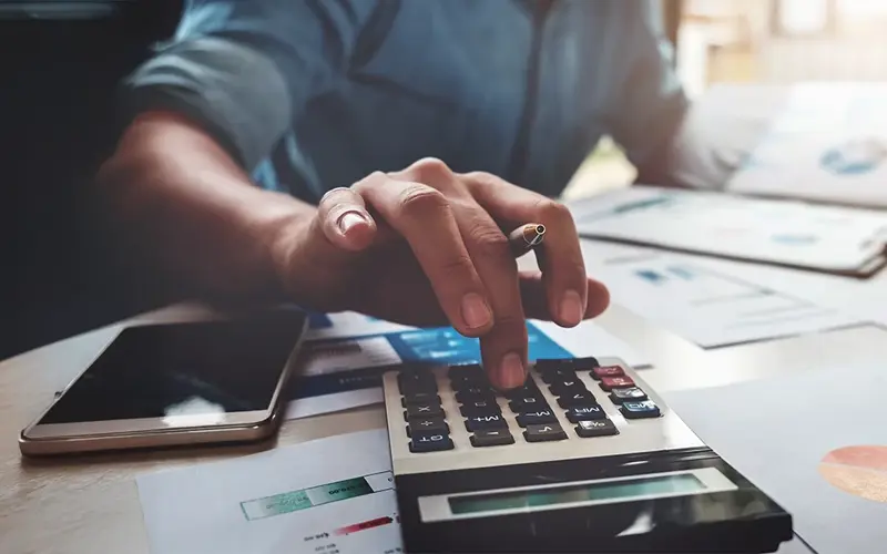 person using a calculator