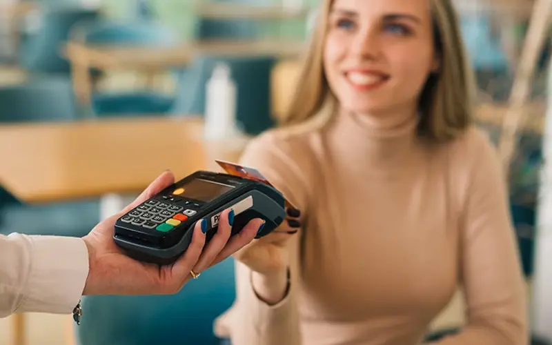 Woman paying with contactless payment