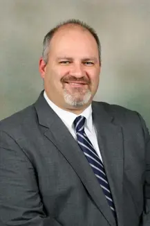 headshot of James McElhenie