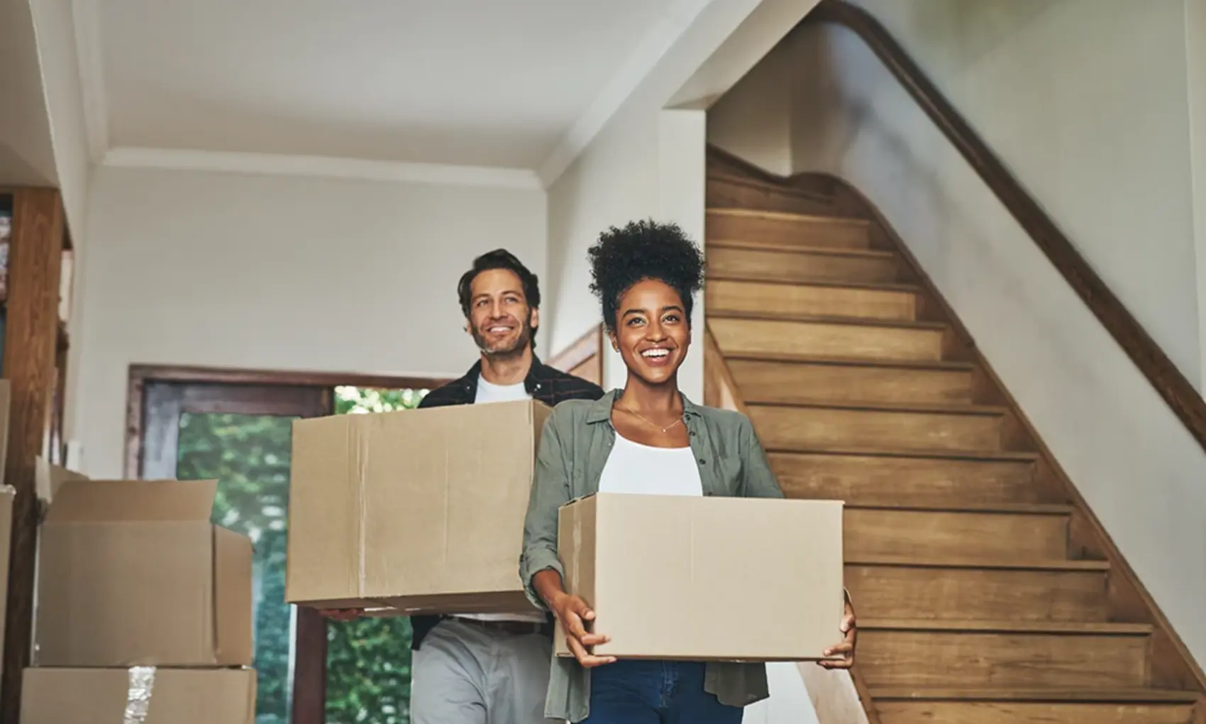 Man and woman moving into a new home