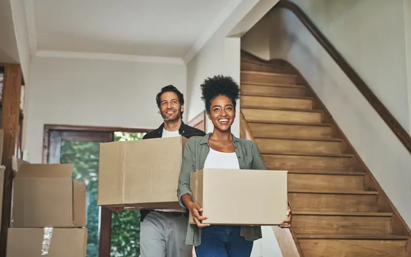 Man and woman moving into a new home