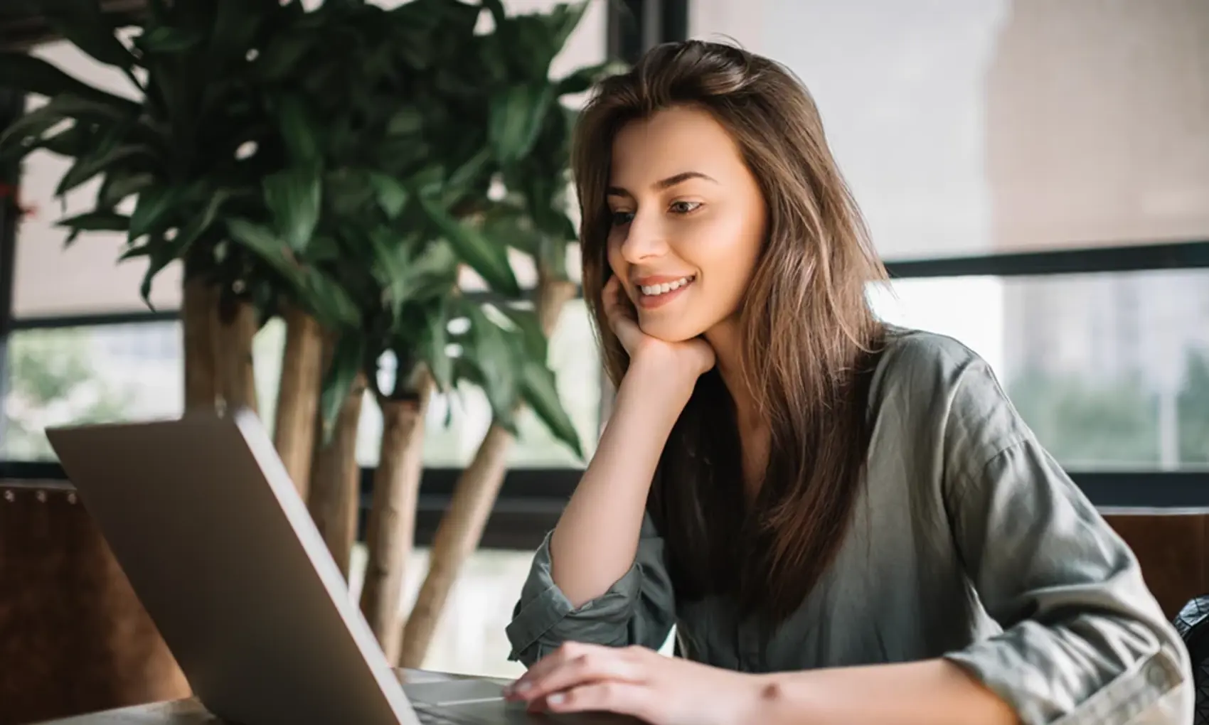 Woman using a laptop at a desk