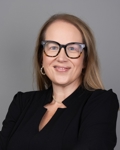 Image of Summer Franzoni wearing a black dress.