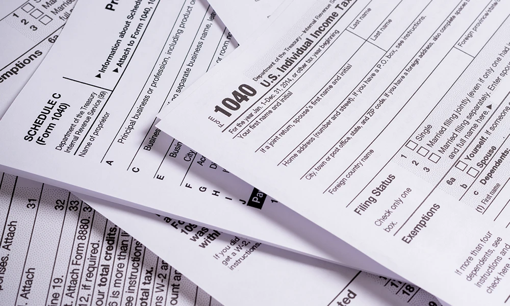various tax forms in a pile