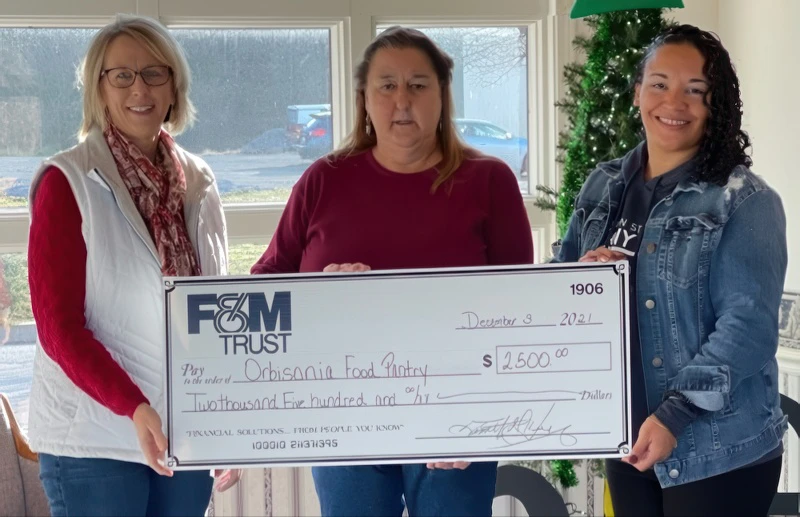 FMT and Orbisonia Food Pantry representatives with large donation check