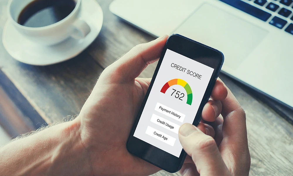 mobile phone displaying person's credit score