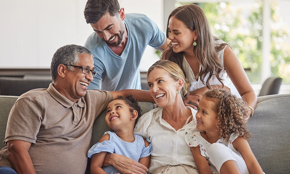 three generations of a family laughing together