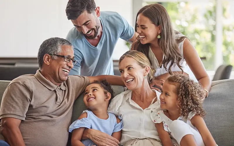three generations of a family laughing together