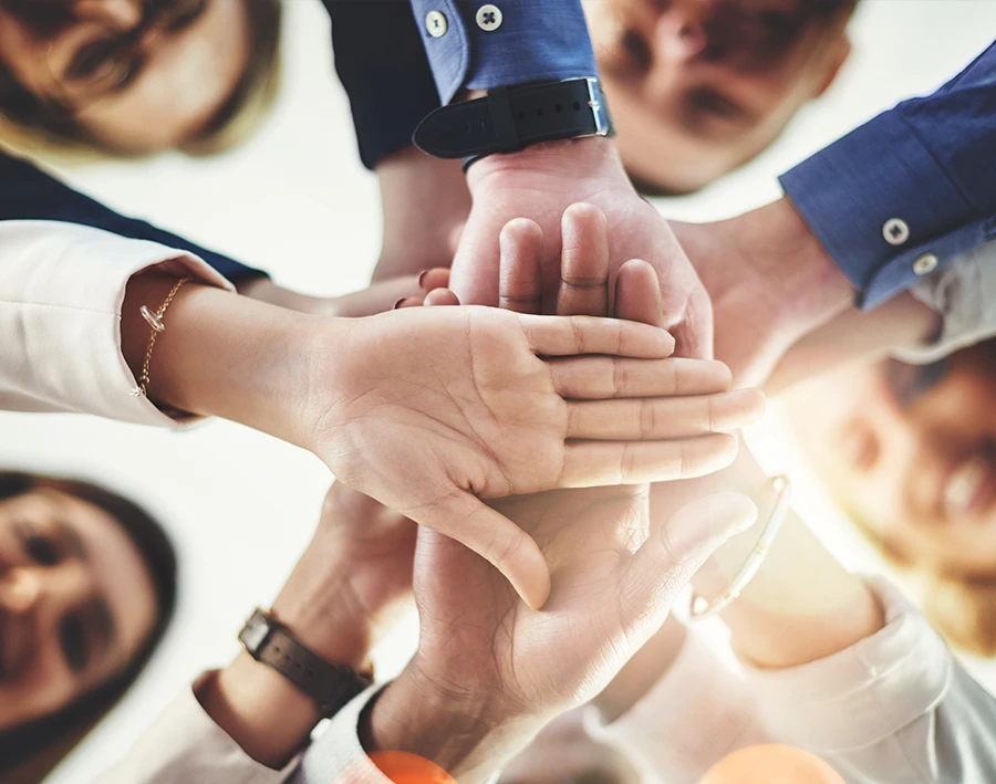 group of people all hands in