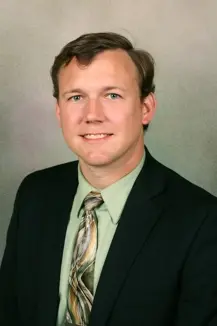 headshot of Adam Smith