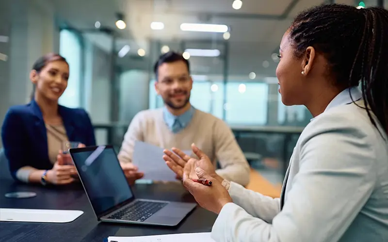 woman talking to a couple