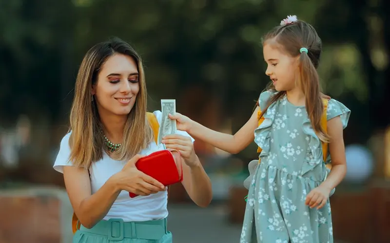 mother teaching child about money