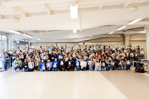 Group photo of all participating F&M Trust employees with two Swatara Police Department officers posed with their Comfort Buddies.