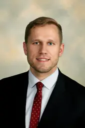 headshot of Adam Hollinger