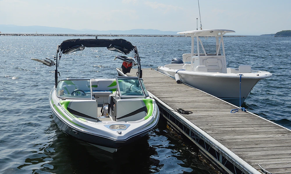 two boats docked at a pier