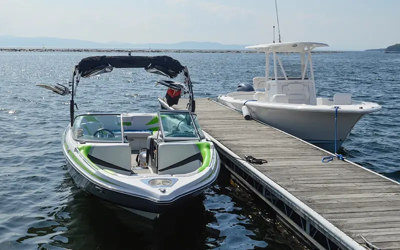 two boats docked at a pier
