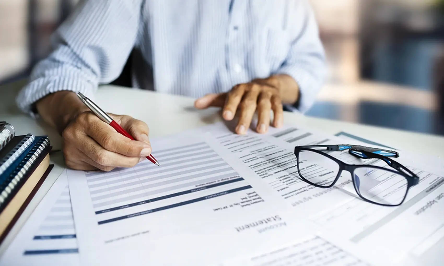 person reviewing statements