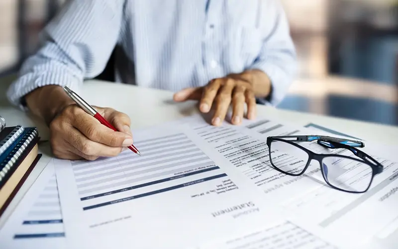 person reviewing statements