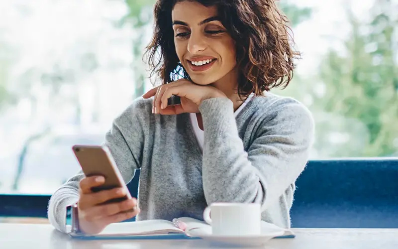 Young woman using phone