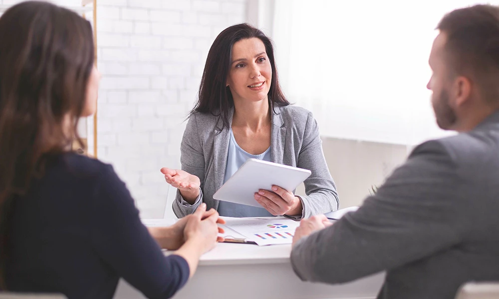 financial planner speaking with a couple