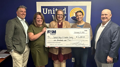 Amy Hicks, Executive Director, and Kelly Frazer, Community Engagement Officer, accept the check from F&M Trust Vice President and Deposit Operations Manager Jordan Peffer, Vice President and Retail Market Manager Summer Franzoni, and Executive Vice President and Chief Operating Officer, Chad Carroll.