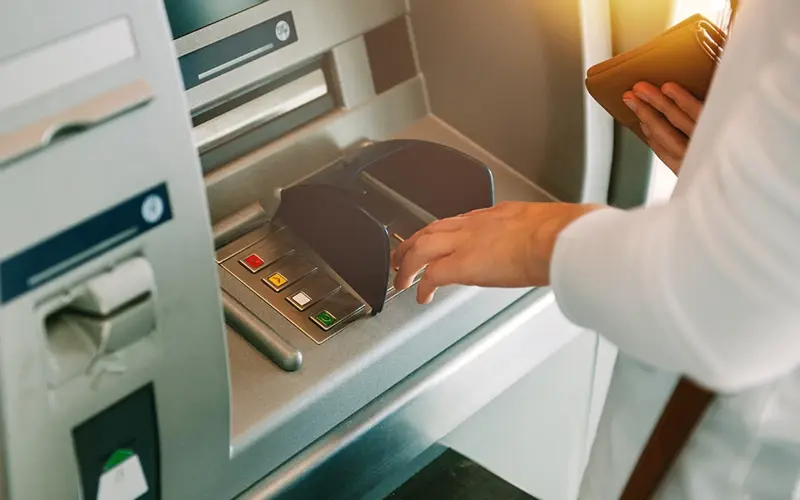 person using ATM machine