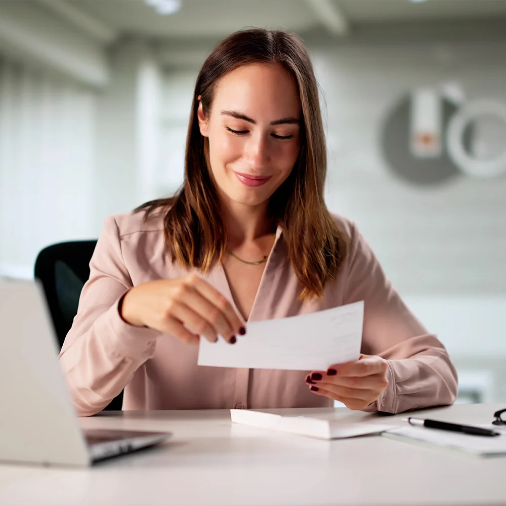 Woman Holding Check In Hand