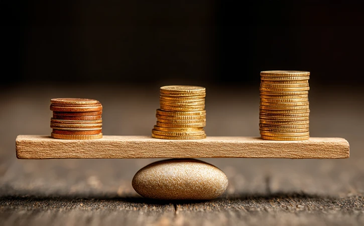 balancing board of stacks of coins