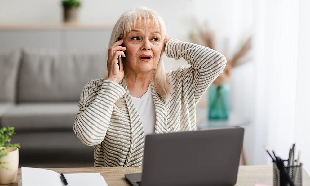 Concerned older woman on the phone