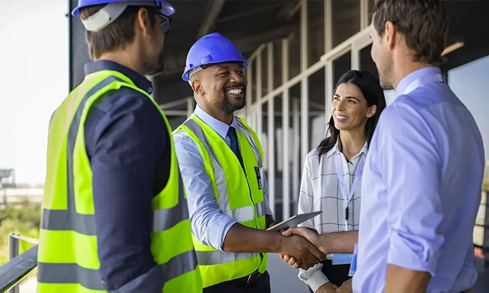Engineer and businessman handshake at construction site