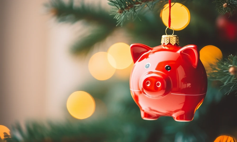 piggybank ornament hanging from Christmas tree 